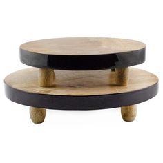 two tiered wooden coffee table with black and wood accents on the top, one shelf is made out of plywood