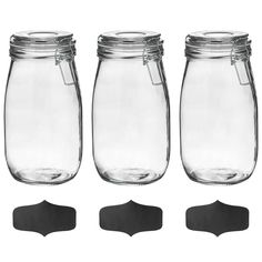 four glass jars with lids are shown in three different sizes and shapes, one is empty