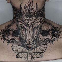 the back of a man's neck with three animals and a dragon on it