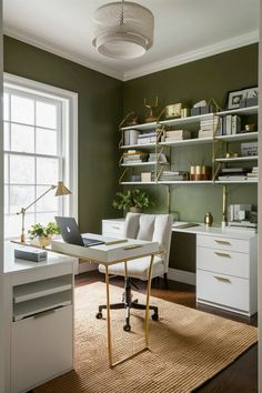 a home office with green walls, white desks and gold accents on the shelves