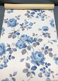 a roll of paper with blue flowers on it