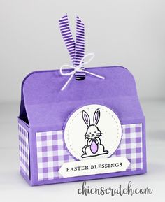 a purple box with an easter bunny on it and a tag hanging from the front