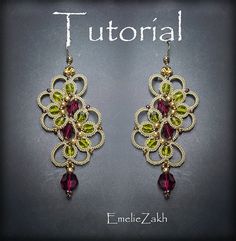 a pair of earrings with green and red stones