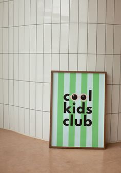 a green and white striped poster with the words cool kids club in black on it