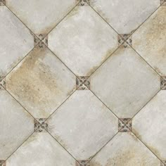 a tile floor with white and brown tiles on it's sides, showing the diamond pattern