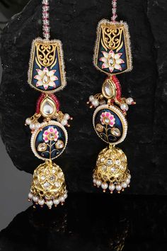 Product Features: Color: Blue, Pink, Gold, White Material: Alloy Metal Design: Kundan, American Diamonds, Pearls, Natural Stones Other Details: Gold-Plated Dimension: Length of Earring= 10 CM; Width of Earring =2.8 CM; Length of Kanchain =10 CM; Width of Kanchain = 1 CM; Adjustable - No Occasion: Party Product Type: Hair Chain Disclaimer: There will be slight difference in digital to actual image Blue Chandbali Jewelry With Cutdana Detail, Blue Chandbali Jewelry With Cutdana, Blue Cutdana Jewelry For Diwali, Blue Cutdana Chandbali Jewelry, Blue Temple Jewelry Jhumkas Gift, Blue Temple Jewelry Earrings For Diwali, Blue Earrings For Diwali, Blue Temple Jewelry Earrings For Festivals, Blue Chandbali Jhumkas With Latkans