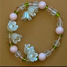 Elegant Lily Of The Valley Flower Pendant Elastic Bracelet. Beads Are Made Of High Quality Glass And Flower Pendants Are Made Of Resin. Friendship Charm Bracelets, Vine Necklaces, Fantasy Objects, Lily Of The Valley Flowers, Valley Flowers, Indie Jewelry, Jewelry Knots, Bracelet Ideas, Elastic Bracelet