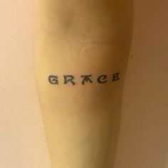 the word grace written on someone's leg