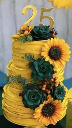 a yellow cake with sunflowers and greenery on top is the number twenty five