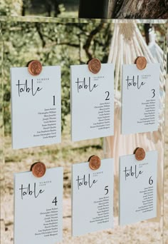 a table plan with coins on it and hanging from a tree in the background for seating