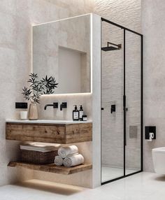 a bathroom with a sink, mirror and toilet