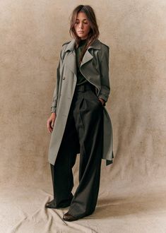 Trench coat with belt to tie at the waist ;Raglan sleeves ;Buttoned tabs at shoulders and cuffs ;Slit with buttons on the back ;Lined ;Water repellent material;Length from shoulder 101 cm / 39.7 in (for a size 36) Tomboy Shirts, Khaki Trench, Khaki Trench Coat, Trench Coat Outfit, French Women, Coat Outfits