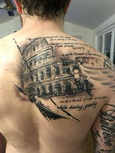 a man with a tattoo on his back