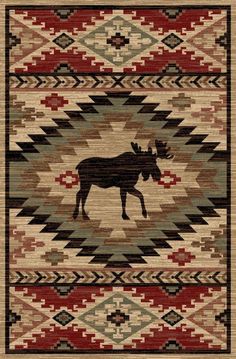 a rug with an moose in the center and native style design on it's side