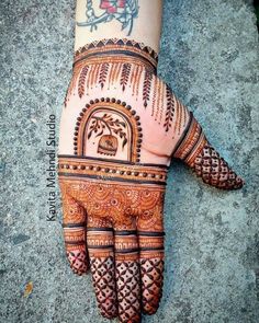 a henna tattoo on the palm of someone's hand