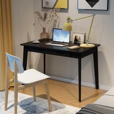 a laptop computer sitting on top of a wooden desk next to a white chair and yellow lamp