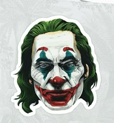 the joker sticker is shown with green hair and clown makeup on it's face