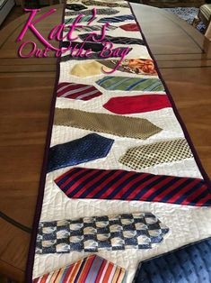 a quilted table runner with ties on it and the words, kaffe's one of the bay