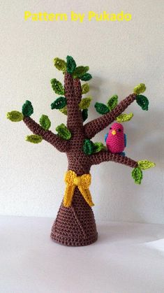 a crocheted tree with a bird on it