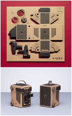 an old fashioned camera is cut out from cardboard and placed on top of each other