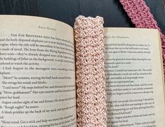 an open book with crochet on top of it