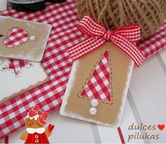 some crafting items are on a table with red and white gingham cloth