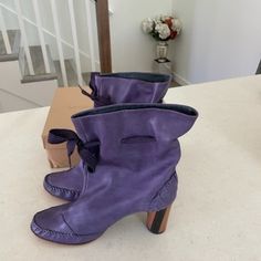 I'm Helping My Aunt Declutter Her Shoe Collection She Compiled Over 30 Years Living In London. I'm A 33 Year Old Male With No Sense Of Fashion So My Descriptions/Pricing Are Probably Off. These Are Violet Leather Boots By Georgina Goodman, A London Based Designer Who Shut Down In 2011. Size 41 Eu. Lightly Worn. Please Message Me For More Pictures/Info! -Devon Purple Leather Block Heels, Luxury Leather Sole Boots For Spring, Luxury Spring Boots With Leather Sole, Leather Boots With Wrapped Block Heel, Designer Purple Leather Heels, Purple Leather Square Toe Heels, Purple Square Toe Leather Heels, Designer Spring Boots With Leather Sole, Designer Leather Boots For Spring