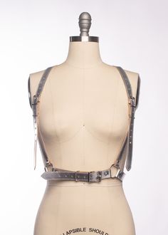 The Katrina Harness is a classic harness style is updated with extra long shoulder straps and bright metallic silver leather (silver leather and gold are now lined and stitched, as shown in mannequin photos). Silver toned nickel plated steel hardware. Fit is adjustable at shoulders and waist. Designed to fit at the natural waist. Also available in metallic gold leather, black matte leather, black vegan leather, and PVC. The leathers used for this piece have a softer hand which works so well with Harness Style, Leather Harness, Black Vegan, Black Matte, Leather Silver, Make Time, Gold Leather, Custom Fit, Extra Long