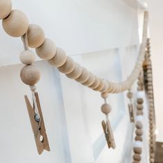 several wooden beads hanging from the ceiling