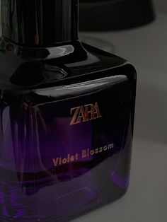 a bottle of zara violet blossom on a table