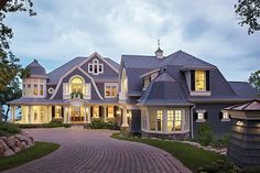 a large house that is lit up at night