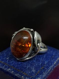 Here we have a stunning vintage statement ring with a beautiful art nouveau inspired design set with sparkling natural Baltic amber gemstone in sterling silver marked 925 UK size - P US size - 7.75 Message me any questions  ITEM - S2216