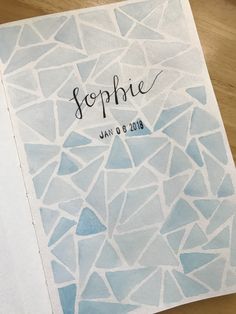 a blue and white wedding guest book with the word's name written on it