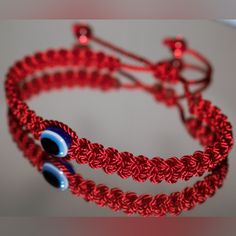 Fashionable And Durable Hand-Made Red String Bracelet With An Evil Eye For Wrist Sizes 6 To 9 Inches, With An Easy To Use Zip Like Function To Fit Your Wrist, You'll Have It On As Soon As You Get It. Made From High Quality Red String, It Will Be Sure To Last. Wearing An Evil Eye As An Amulet Is Believed To Provide Protection Against Evil Forces. The Evil Eye Meaning Has Symbolism In Almost Every Country In The World And In Every Religion. Brand New Handmade Red Casual Friendship Bracelets, Casual Red Handmade Friendship Bracelets, Handmade Adjustable Red Evil Eye Bracelet, Casual Red Resizable Friendship Bracelets, Casual Red Resizable Jewelry, Handmade Red Evil Eye Bracelet, Casual Red Braided Bracelets As Gift, Casual Red Braided Bracelets For Gift, Casual Red Resizable Braided Bracelets