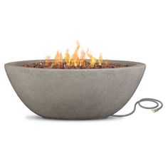 an outdoor fire pit is shown with the light on it's side and flames coming out