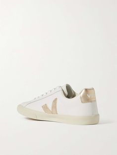 VEJA + NET SUSTAIN Esplar metallic-trimmed leather sneakers | NET-A-PORTER Metallic Leather Sneakers With Metallic Logo, Sporty Metallic Sneakers, Leather Low-top Sneakers With Foil Embossed Logo, Low-top Leather Sneakers With Foil Embossed Logo, Metallic Leather Lace-up Sneakers, Gold Leather Sporty Sneakers, Sporty Metallic Leather Sneakers, Metallic Low-top Sneakers With Perforated Toe Box, Luxury Leather Sneakers With Metallic Logo