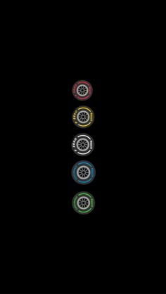 four different colored wheels are shown in the middle of a black background with white and red stripes