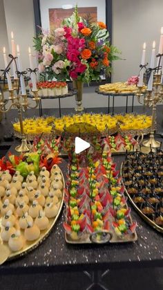 a buffet table filled with different types of desserts