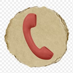 a red phone sitting on top of a piece of paper next to a stone circle