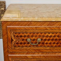 A matched pair of veneered, fruitwood and walnut marquetry commodes with Sienna marble tops.  Bronze mounts with traces of gilding. Oxblood Red, Modern History, Dressers And Chests, Marquetry, Casegoods, Marble Top, Brass Finish, Mid-century Modern, Walnut