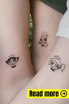 two people with matching tattoos on their legs, one has a dog and the other has a cat