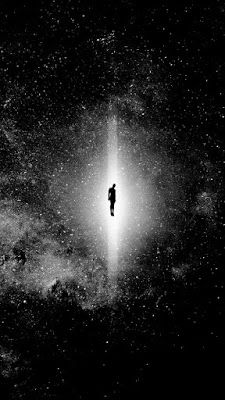 a person standing in the middle of a space filled with stars