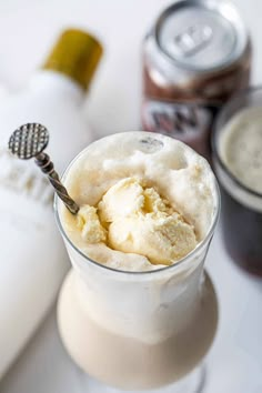 an ice cream dessert in a glass with a spoon