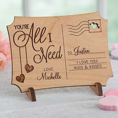 an all i need is you wooden card holder with hearts and envelopes on it