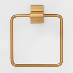 a gold square towel ring on a white background