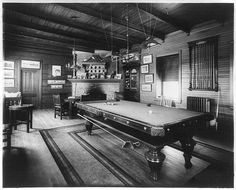 an old fashioned pool table in the middle of a room