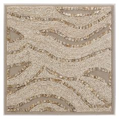 a beige and white wall hanging on the side of a building with lots of beads in it