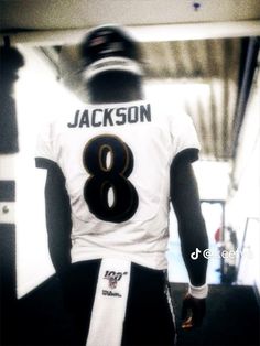 the back of a football player's uniform with his name on it and number eight