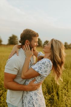 a man and woman embracing in a field