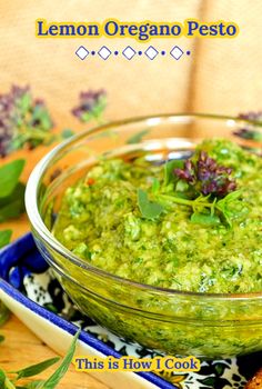 this is how i cook lemon oregano pesto in a glass bowl on a blue and white plate